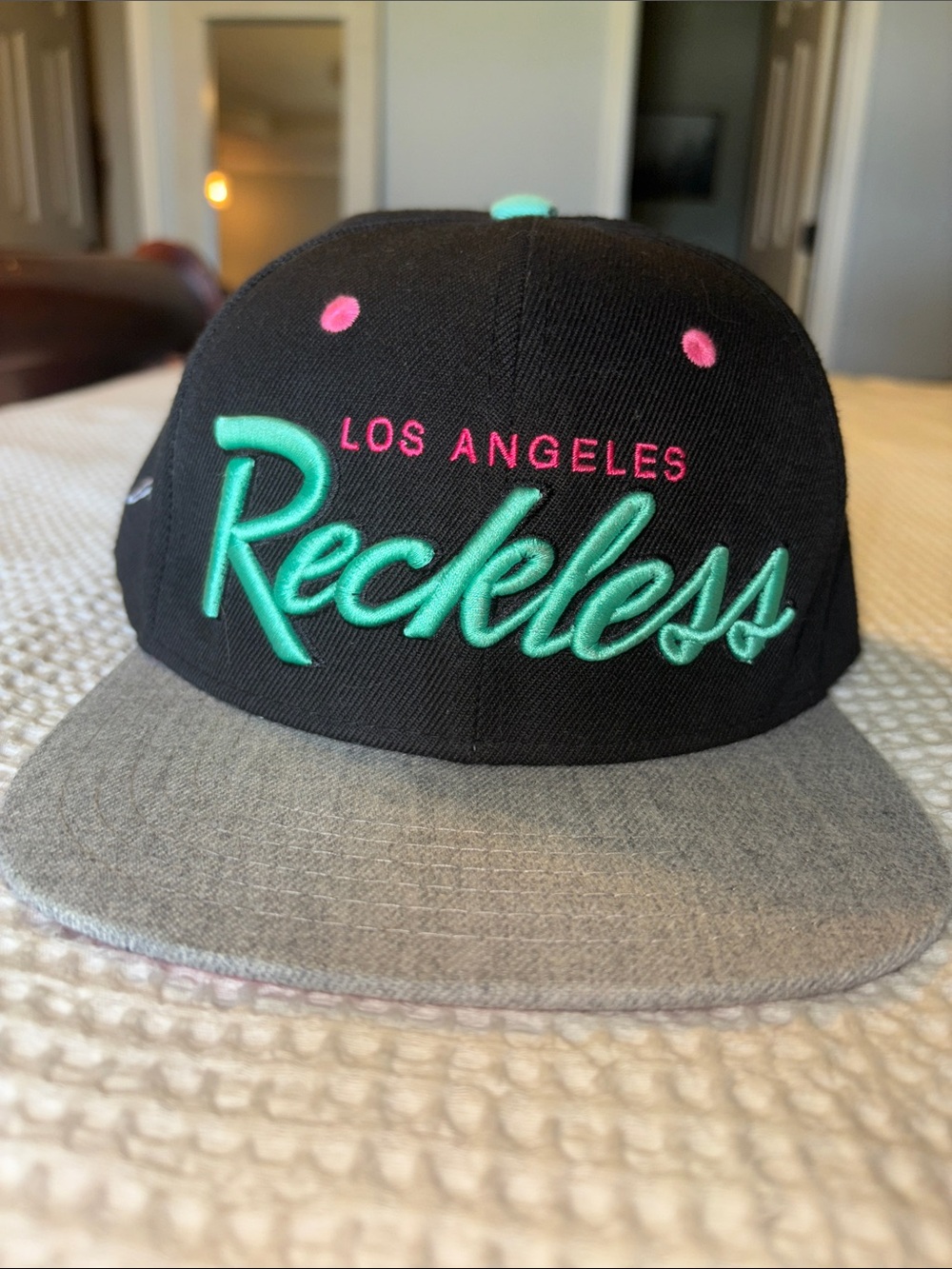 Young & Reckless Black Snapback Hat with Teal Script and Pink Accents